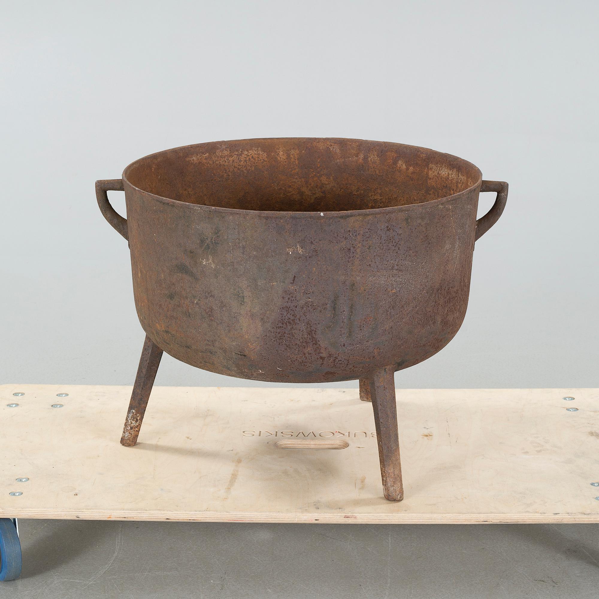 A 19th century iron pot.