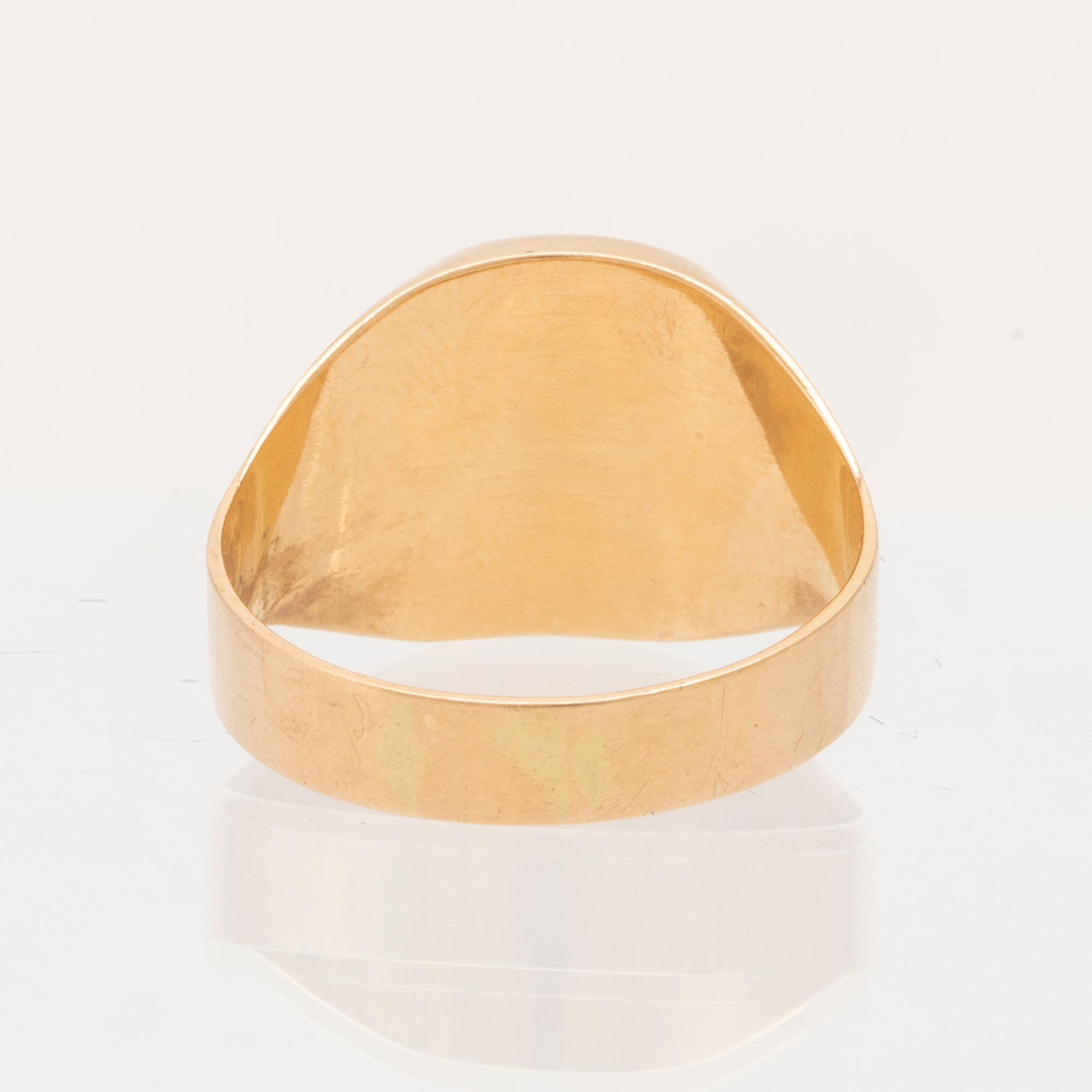 Ring klackring 18K guld med svart sten.