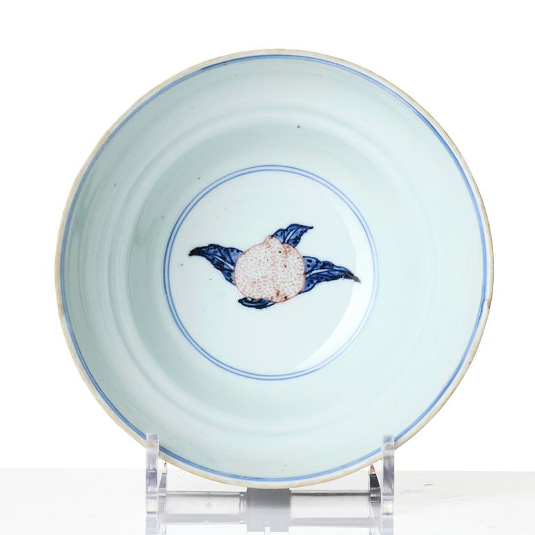 A blue and white and copper-red 'peaches' bowl, Qing dynasty.