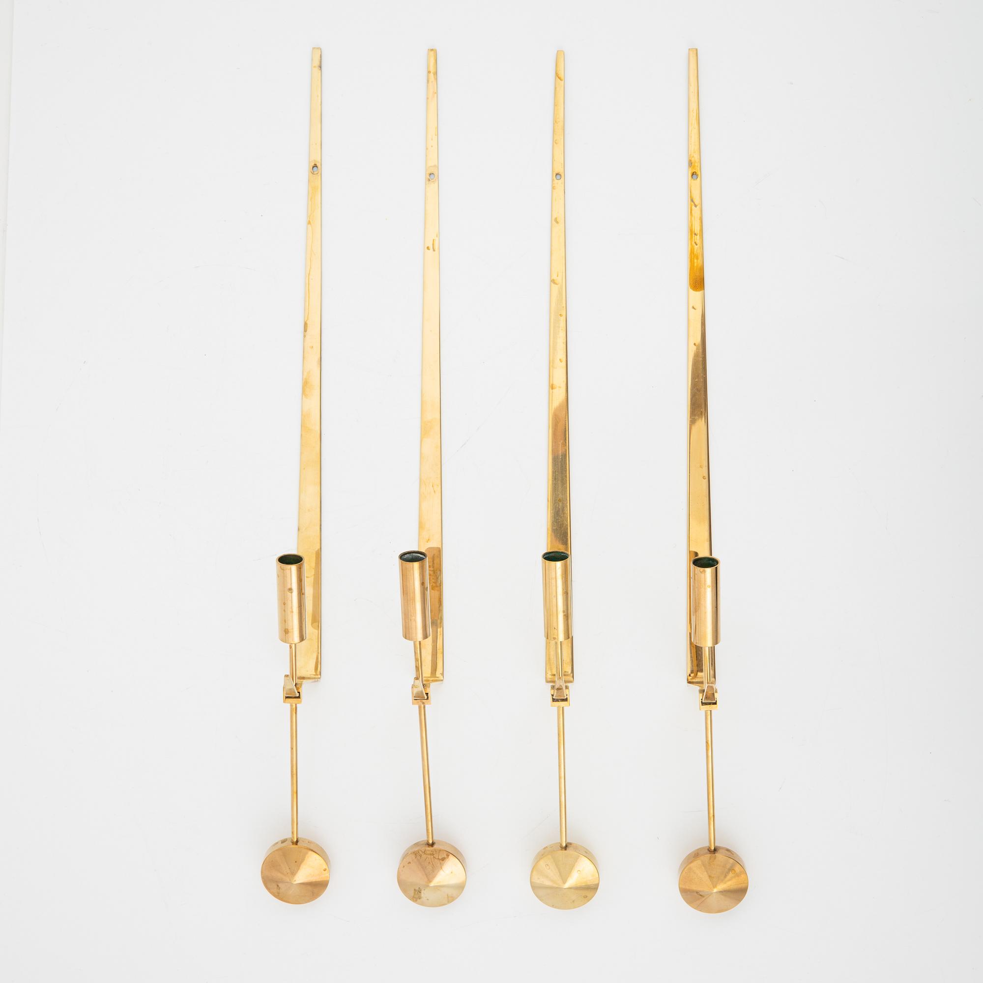 Pierre Forssell, a set of four brass 'Pendeln' wall lights from Skultuna, late 20th Century.