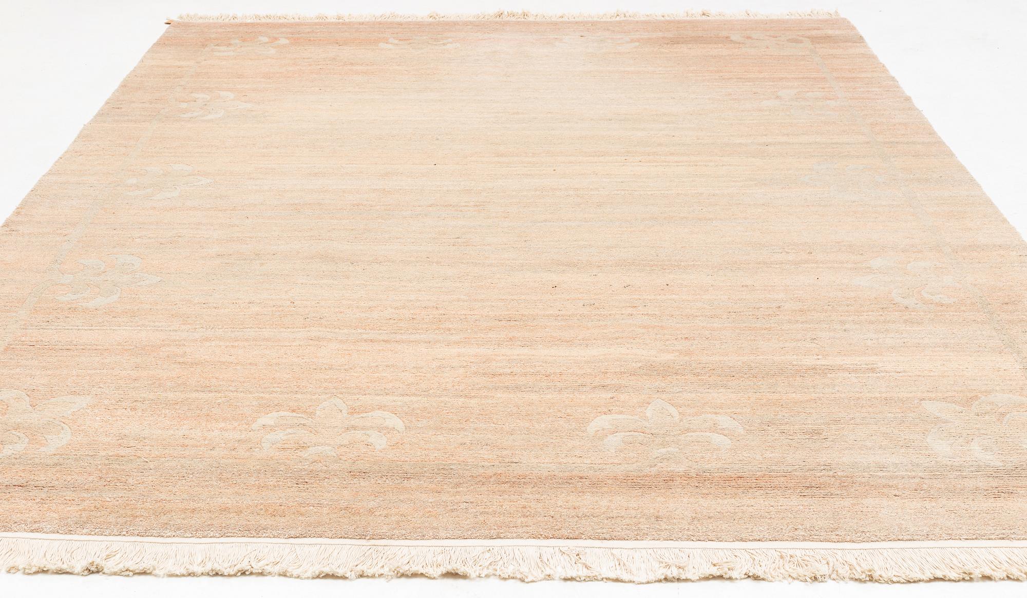 A Chinese carpet, c. 330 x 270 cm.