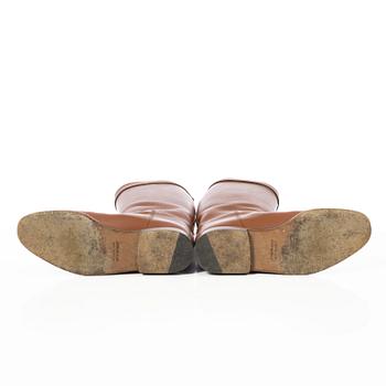 Hermès, a pair of riding boots.