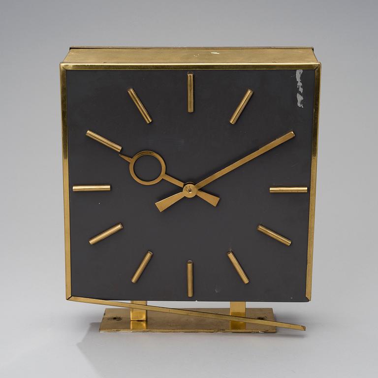 A TWO SIDED WALL CLOCK. From "Kuparitalo" (Copper House) in Helsinki. Late 1950s.