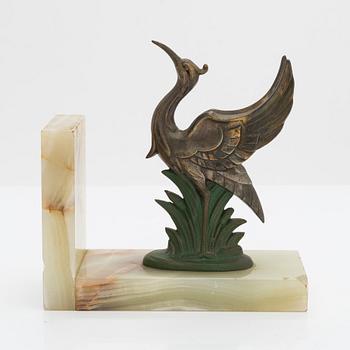 A pair of alabaster and  patinated metal Art Deco bookends from the first half of the 20th Century.