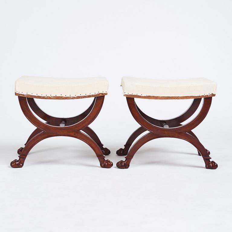 A pair of Directoire mahogany stools, circa 1800.