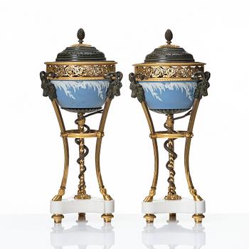 A pair of gilt bronze, marble and ceramic potpourri urns with covers, 19th century.