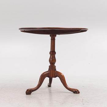 A tilt-top table, 19th century.