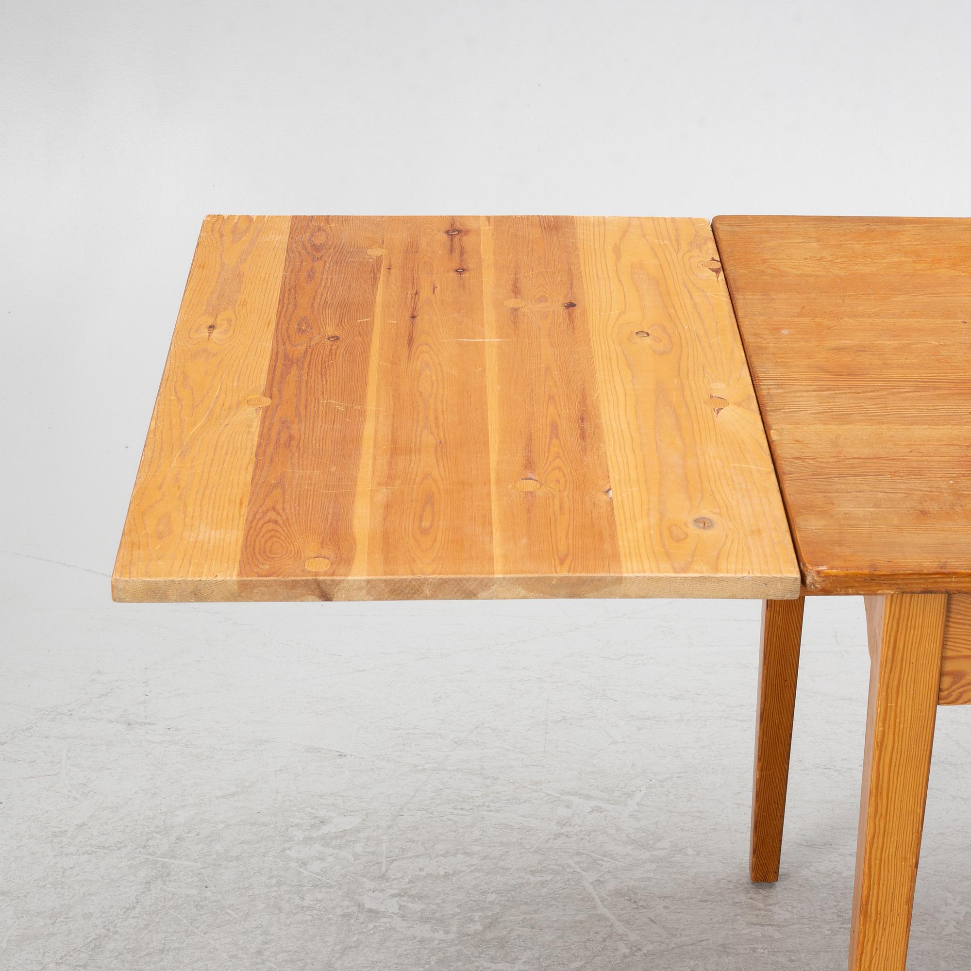 Carl Malmsten, dining table and four chairs, including Svensk Fur, second half of the 20th century.