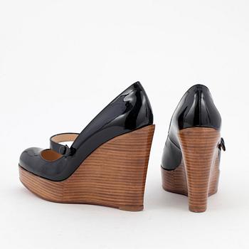 CHRISTIAN LOUBOUTIN, a pair of black patent wegde shoes, "Mary Jane Wallis". Size 37.