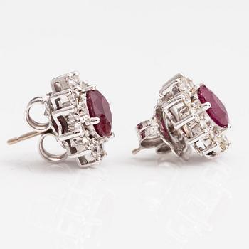 A pair of 18K white gold earrings with brilliant cut diamonds ca. 0.96 ct in total and rubies. Rubens, Helsinki.