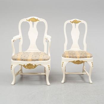 A dining table and six chairs, rococo style, mid 20th century.