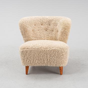 A Swedish Modern easy chair, 1940's/50's, the model has been sold via Gösta Jonsson.