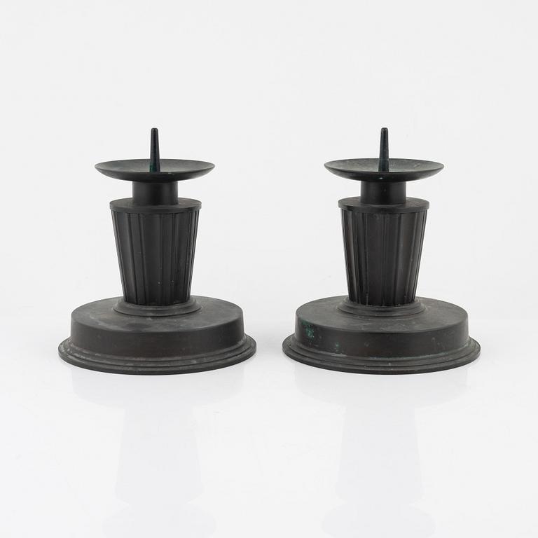 A pair of bronze candlesticks, 1920's-/30's.