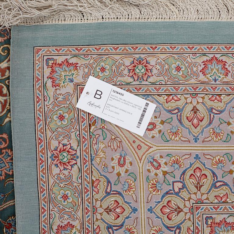 A CARPET, Old silk Qum, signed Moghadam, ca 309,5 x 190,5 - 193 cm.