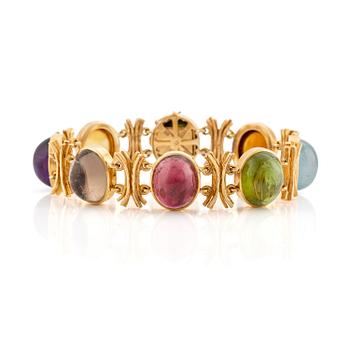 499. A W.A. Bolin bracelet, design Barbro Littmarck, 18K gold with cabochon-cut coloured stones, Stockholm 1970.