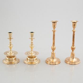Two pairs of brass candlesticks, 19th century - early 20th century.
