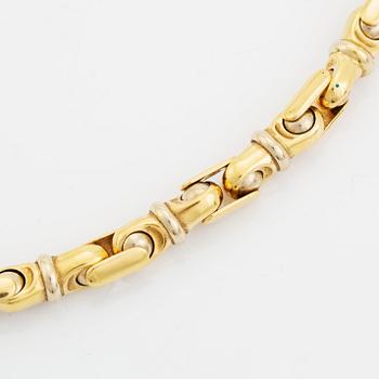 An 18K gold necklace/bracelet combination.