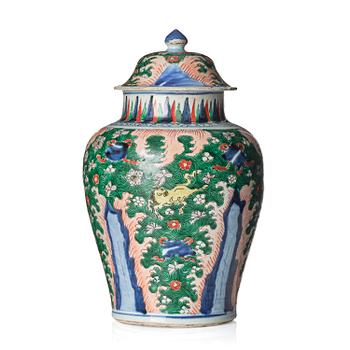 1213. A Transitional wucai 'flying horse' baluster jar with cover, 17th century.