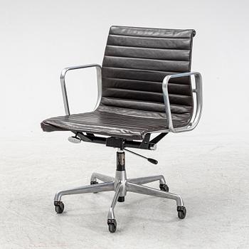 An EA 118 swivel office chair by Charles and Ray Eames for Herman Miller.