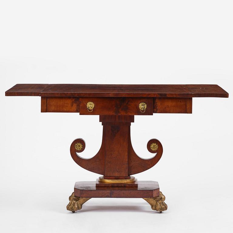A Swedish Empire mahogany center table.