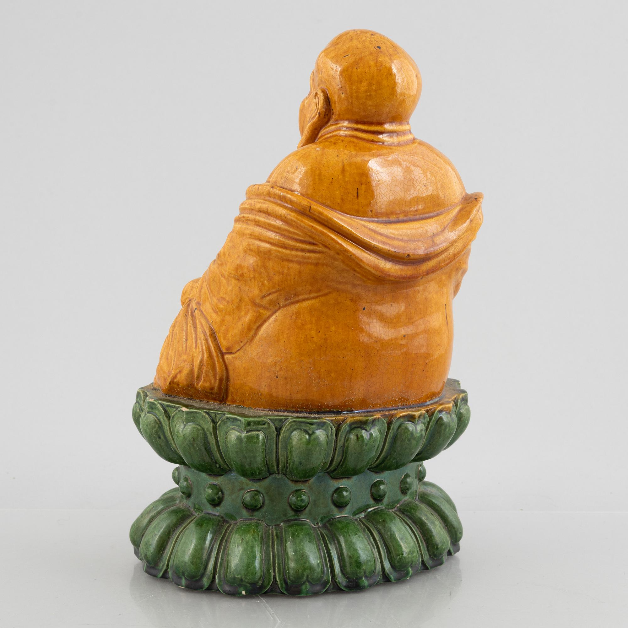 A ceramic Budai, China, 20th century.