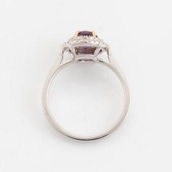 An 18K white gold ring set with a faceted ruby.