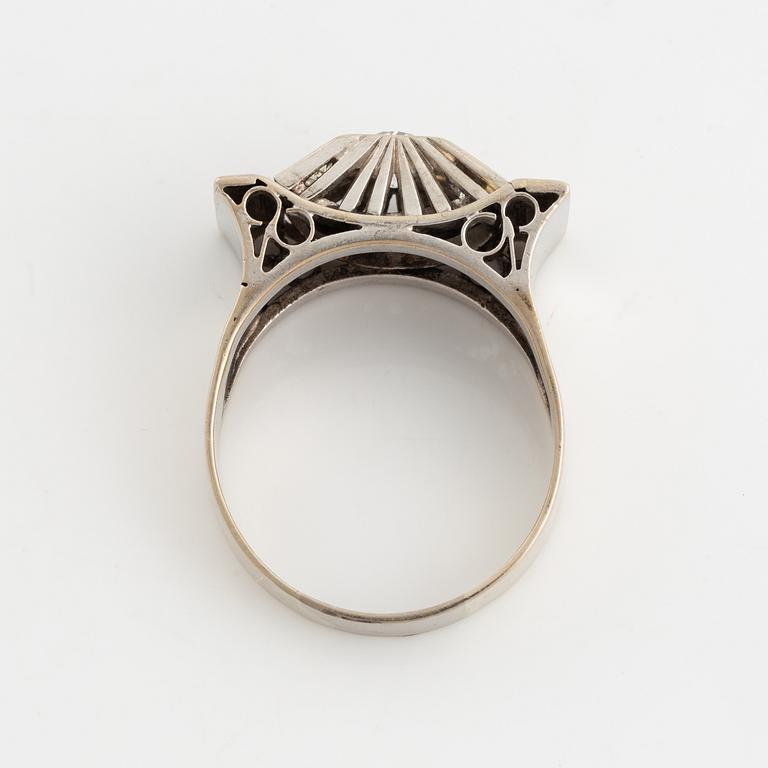 A 14K gold ring set with old-cut diamonds.