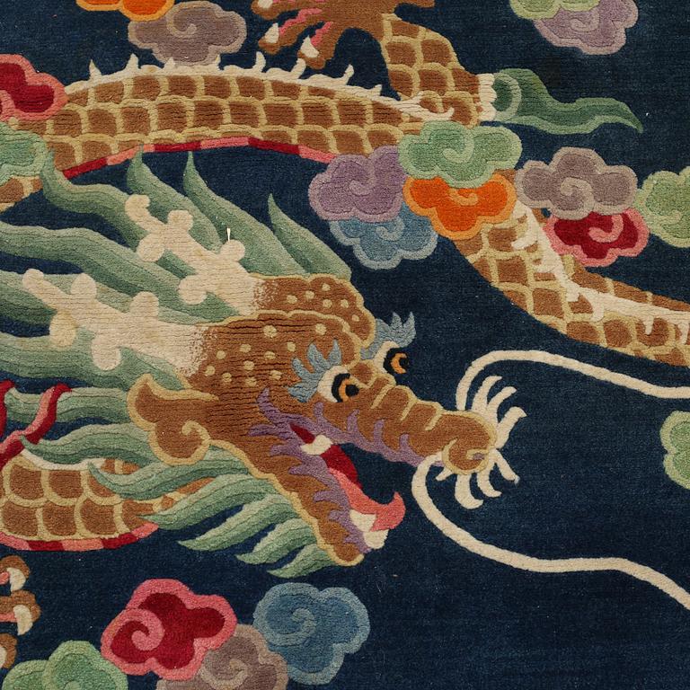 A rug from China, old, 208 x 122 cm.