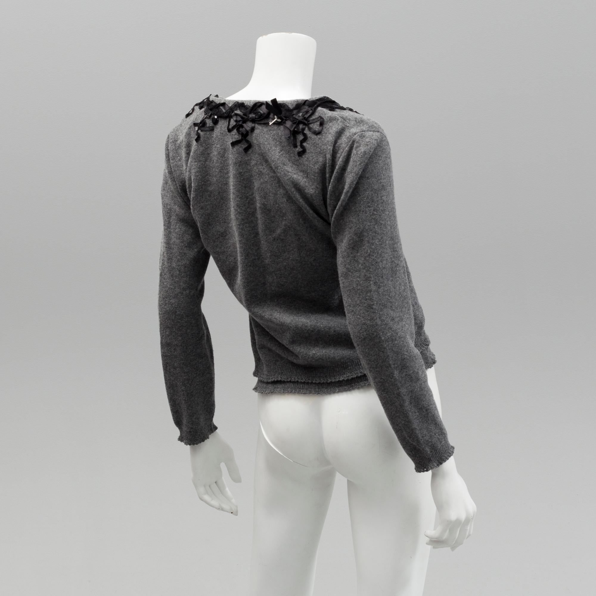 Cardigan and top by Moschino, Cheap and Chic.