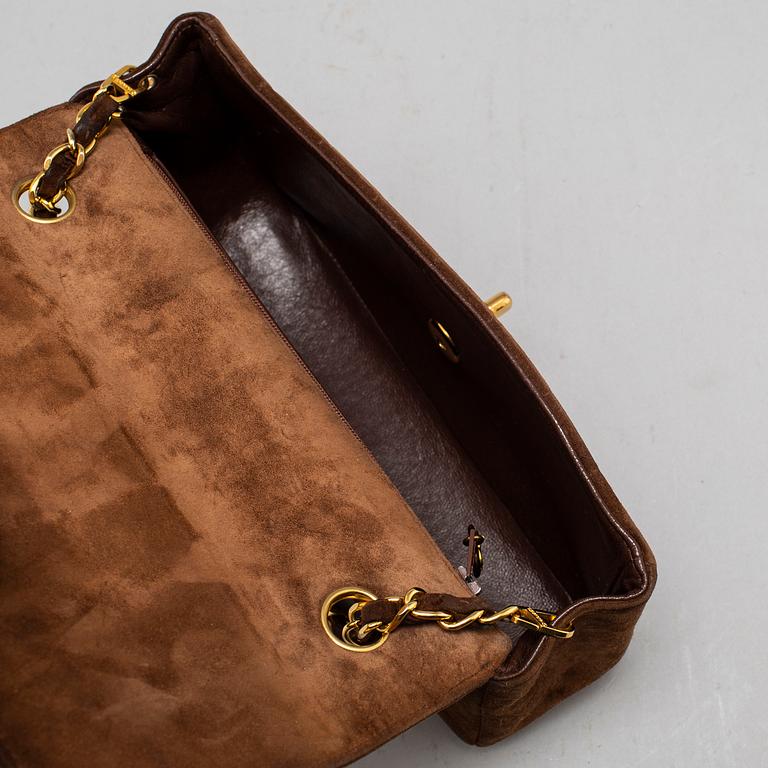 CHANEL, a suede hand bag.