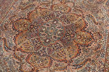 A semi-antique oriental carpet, c. 290 x 195 cm.