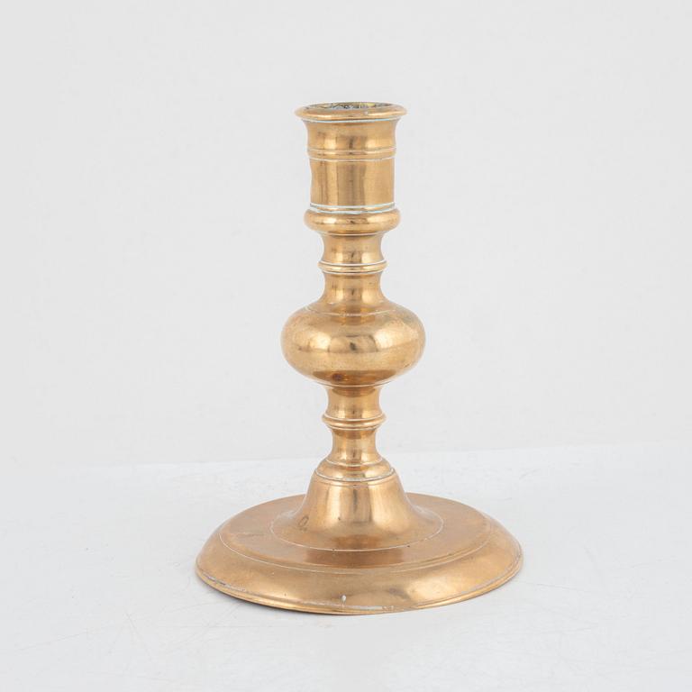 A Baroque brass candlestick, 17th century.