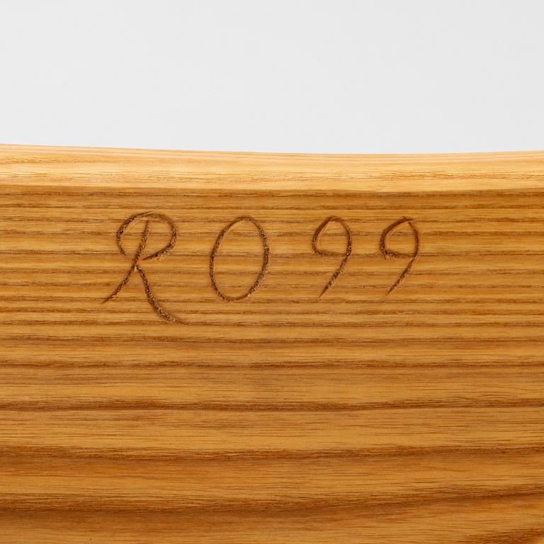 A solid pine stool, signed RO -99, Sweden.