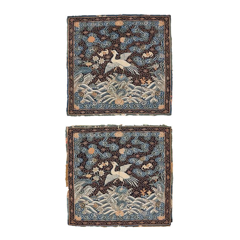 A pair of kesi official's rank badges with silver pheasants, Qing dynasty, early 19th century.