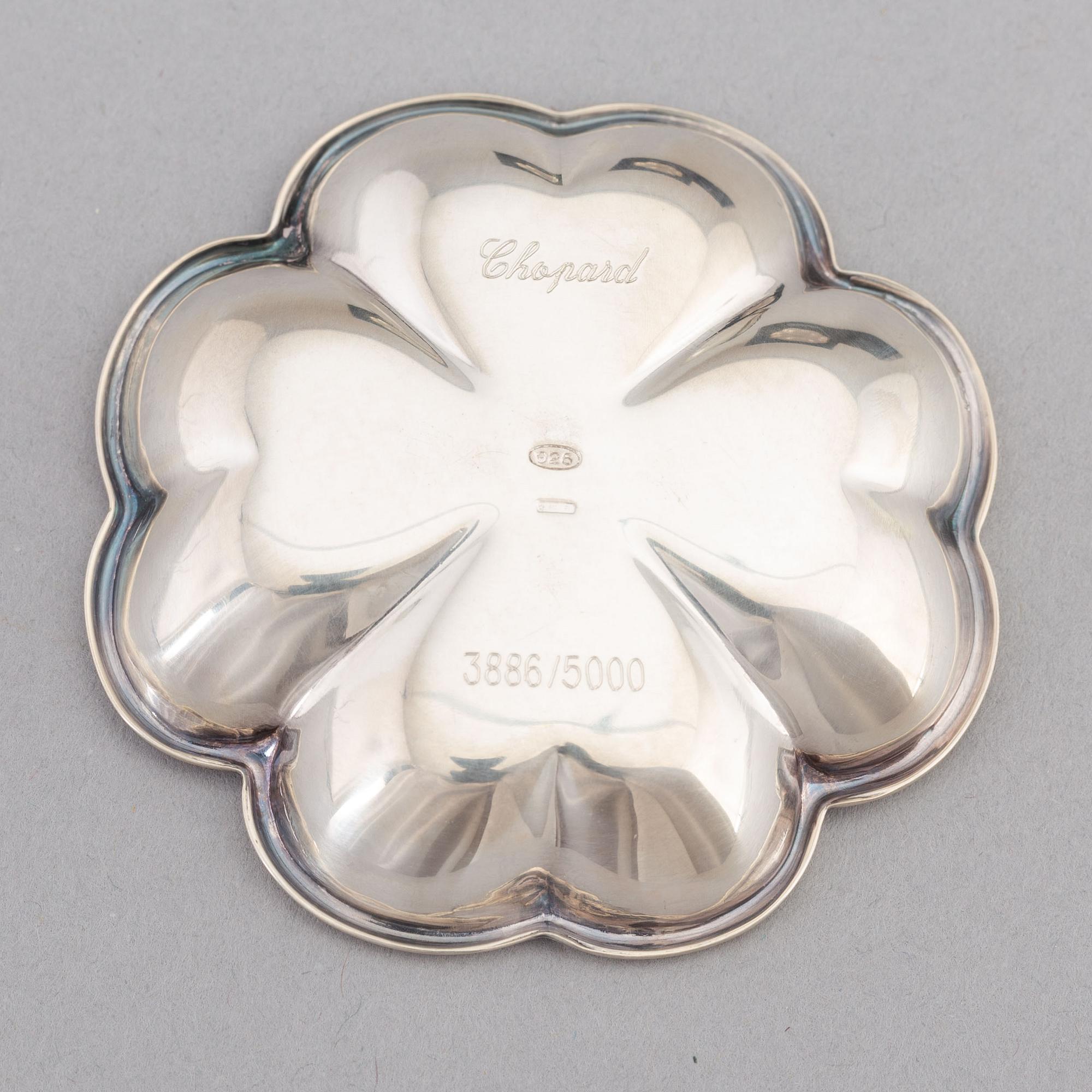 De Grisogono, a set of five silver dishes, Chopard, Switzerland.