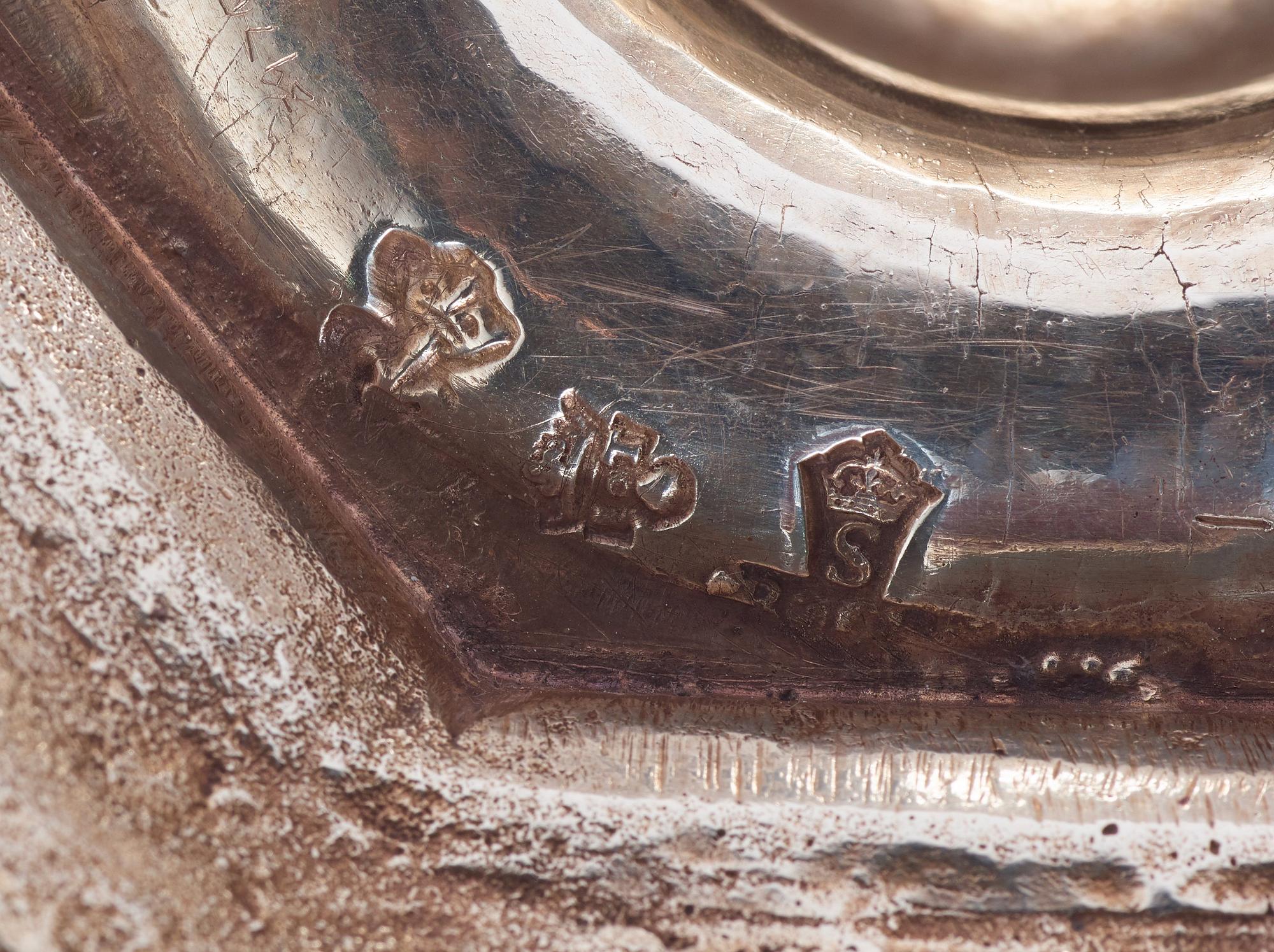 A pair of European 18th century silver candlesticks, unidentified makers mark.