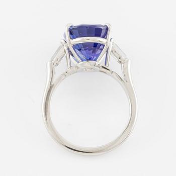 Ring, Fred Leighton platinum with an oval faceted tanzanite and fancy-cut diamonds.
