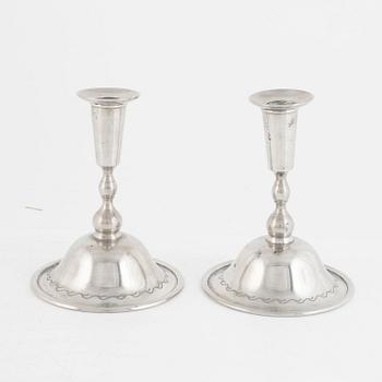 Firma Svenskt Tenn, a pair of pewter candlesticks model "76", Stockholm 1925.