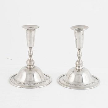 Firma Svenskt Tenn, a pair of pewter candlesticks model "76", Stockholm 1925.