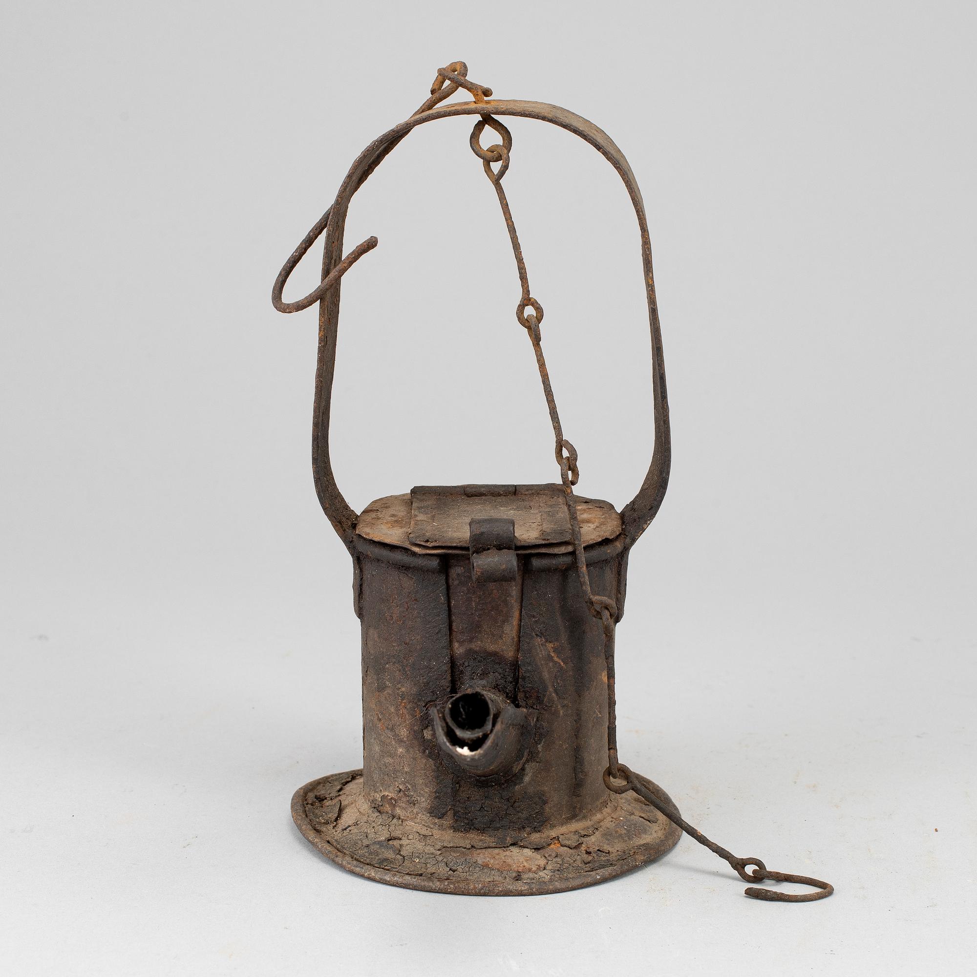 A 19th century tinplate oil lamp.