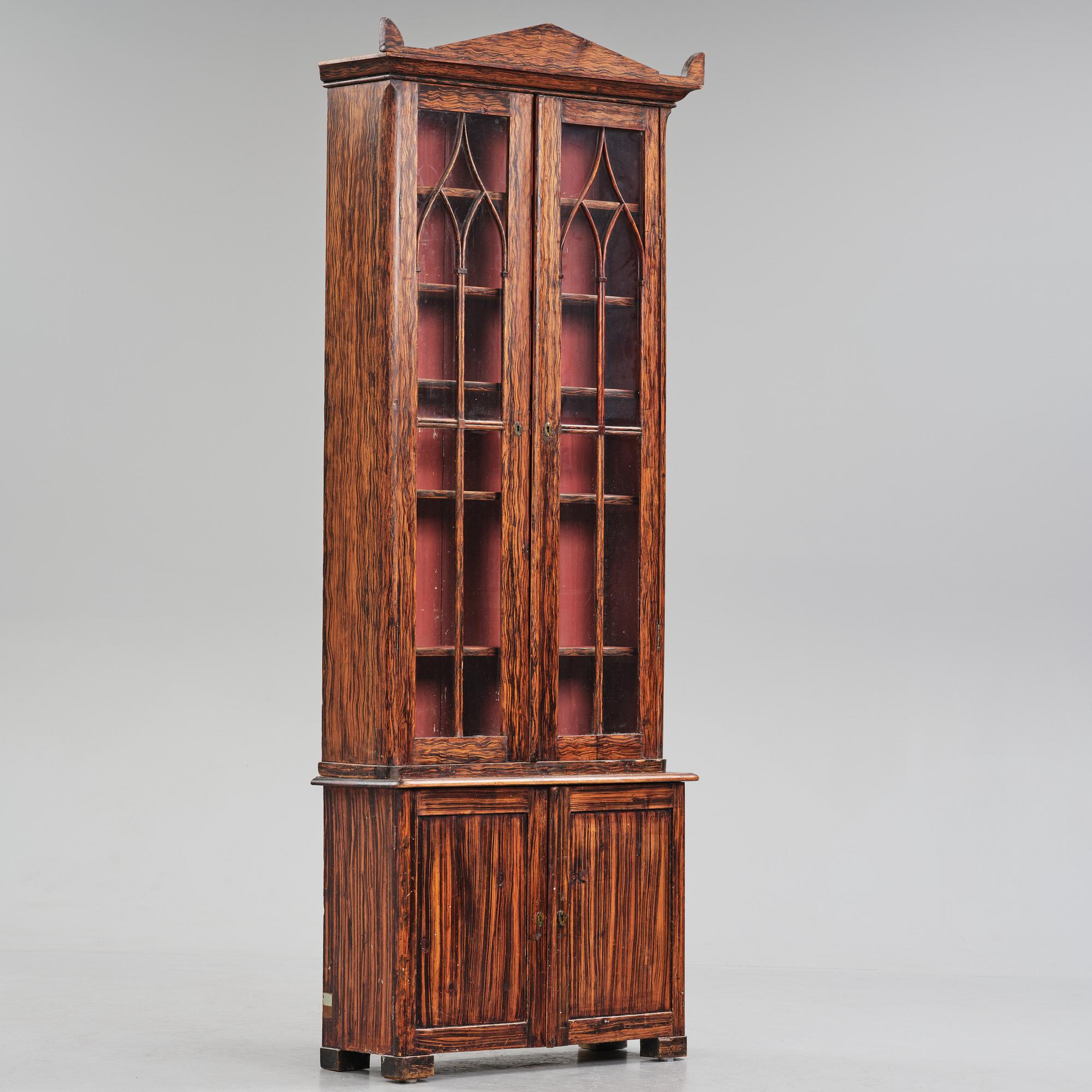 A Swedish faux-boix neo-gothic book cabinet, ca 1830.