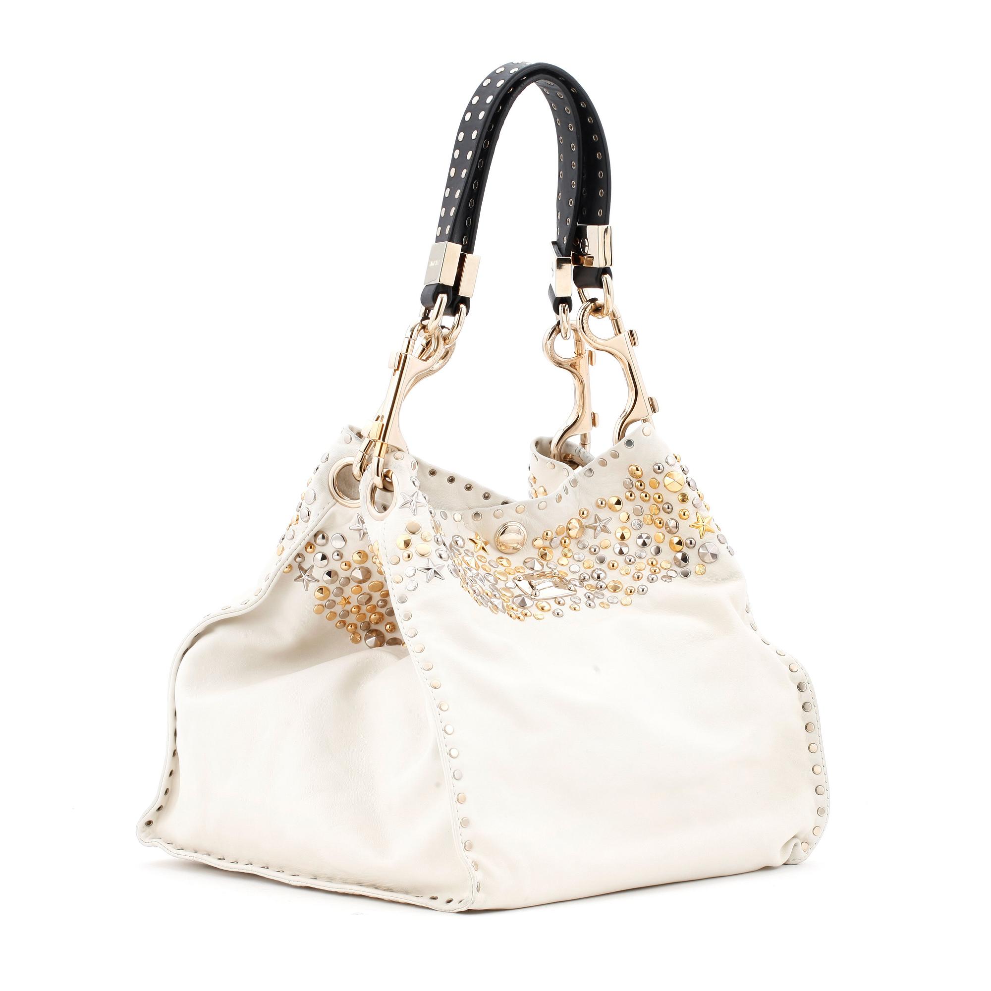 JIMMY CHOO, a white leather handbag with studs.