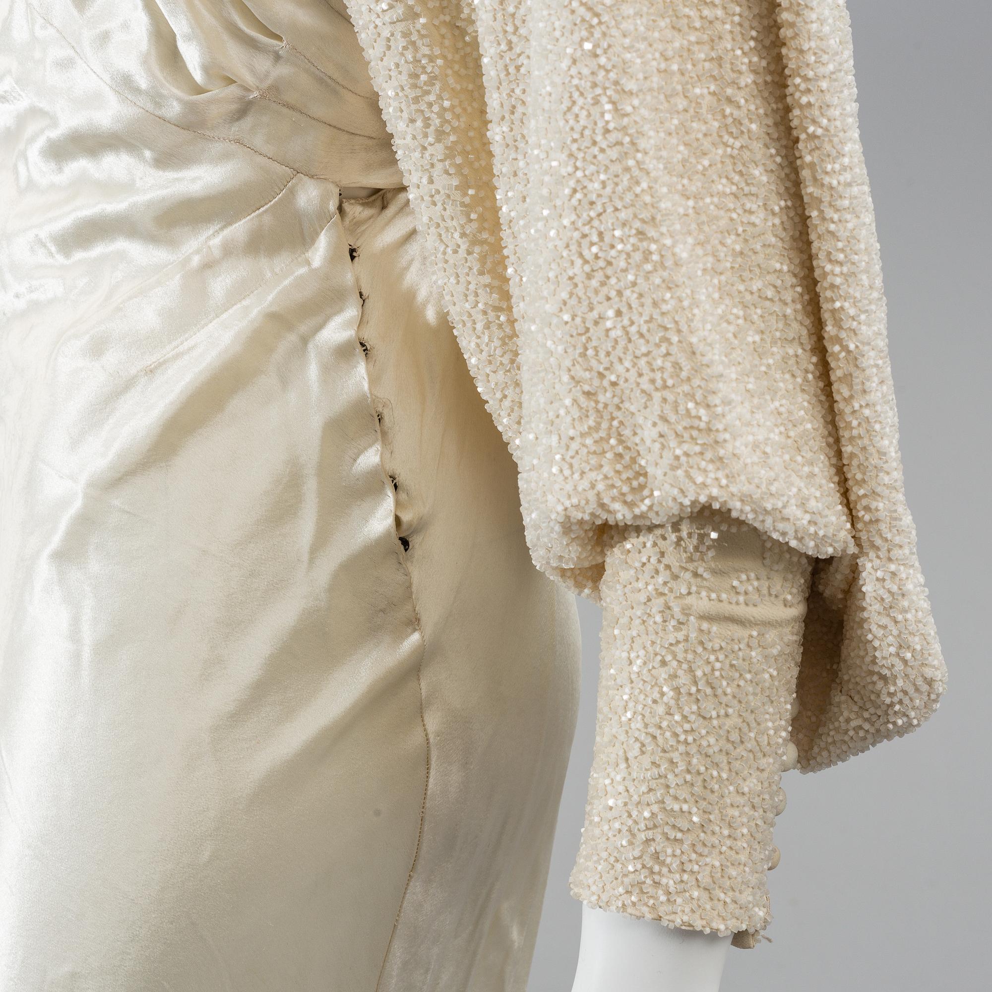 A satin wedding dress, circa 1935.