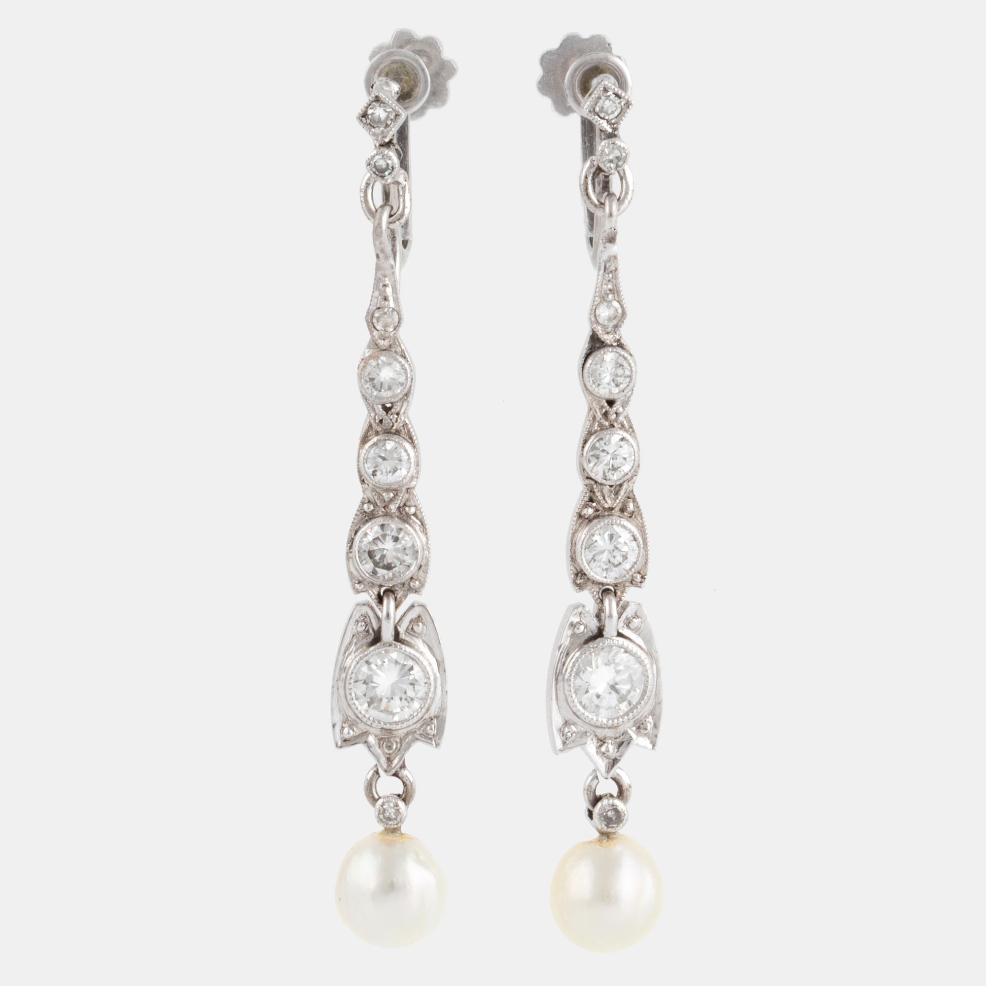 A pair of 18K white gold brilliant-cut and pearl earrings.