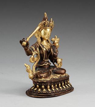 A Sino-tibetan gilt copper figure of a Bodhisattva, Qing dynasty, 19th Century.