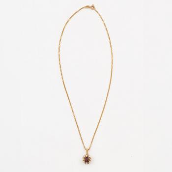 Pendant with gold chain, 
Pendant with white gold chain, 
Earrings a pair, rubies with brilliant-cut diamonds.