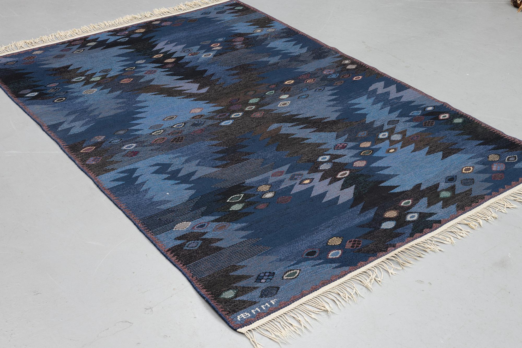 Barbro Nilsson, a carpet, "Tånga blå", flat weave, ca 243,5 x 173 cm, signed AB MMF BN.