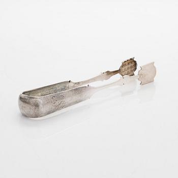 A four-piece silver coffee set, St. Petersburg 1887, original fitted box from Khlebnikov. Sugar tong, Moscow around 190.