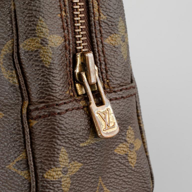 A Louis Vuitton "Trousse Toilette 23" beauty bag.