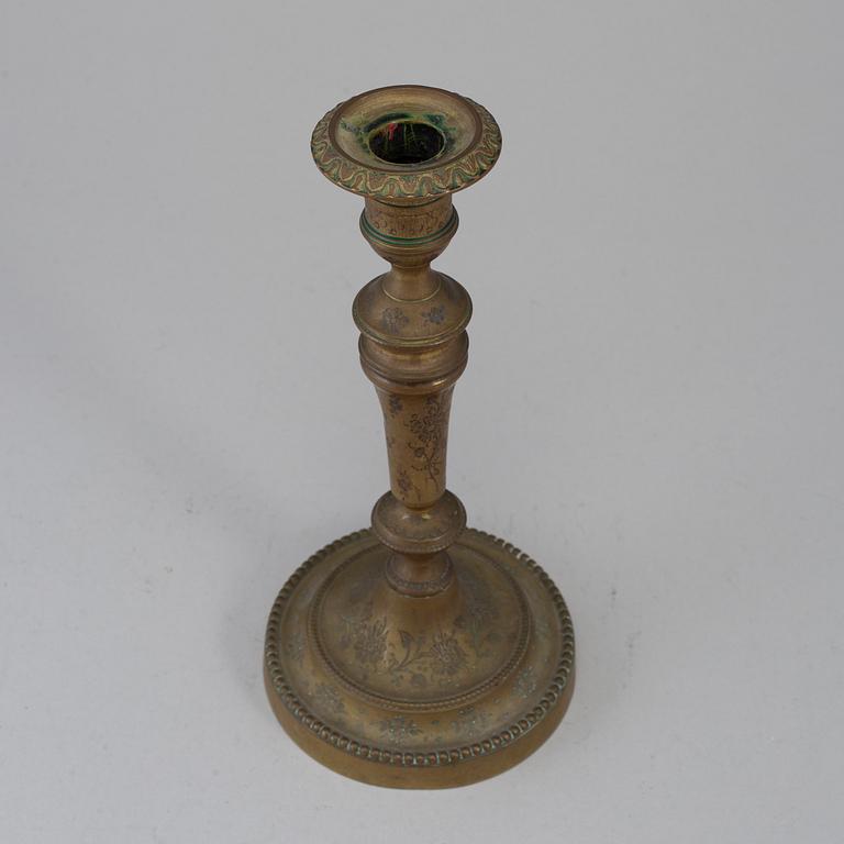 A late 18th century bronze candlestick.